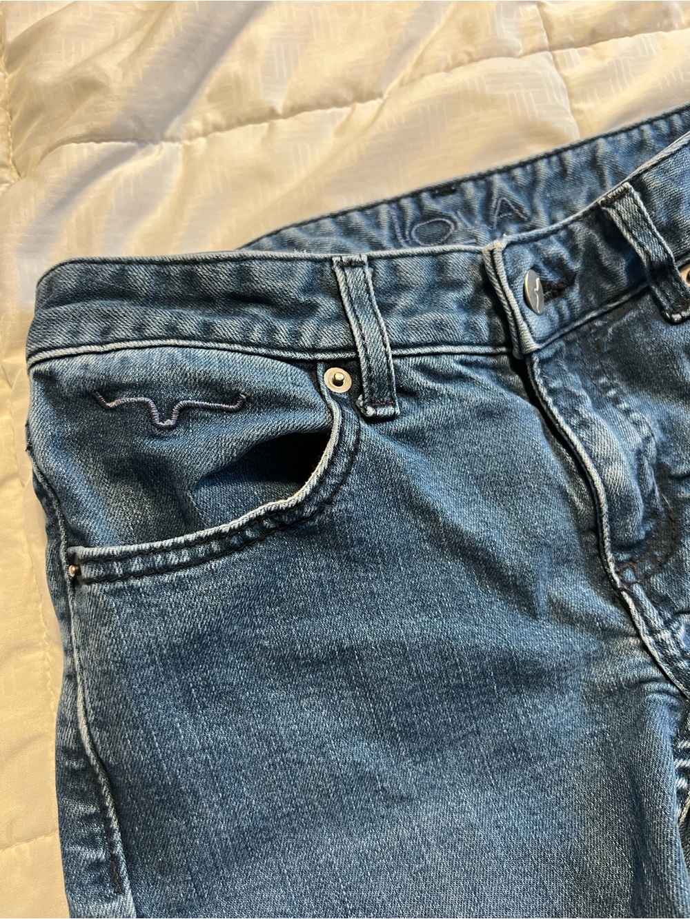 Classic Medium Wash Flare Denim Jeans with Dark Purple Pocket Stitching